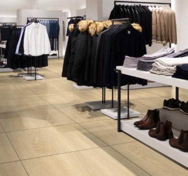 [:en]Empty modern fashionable brand interior of clothing store inside shopping center[:]